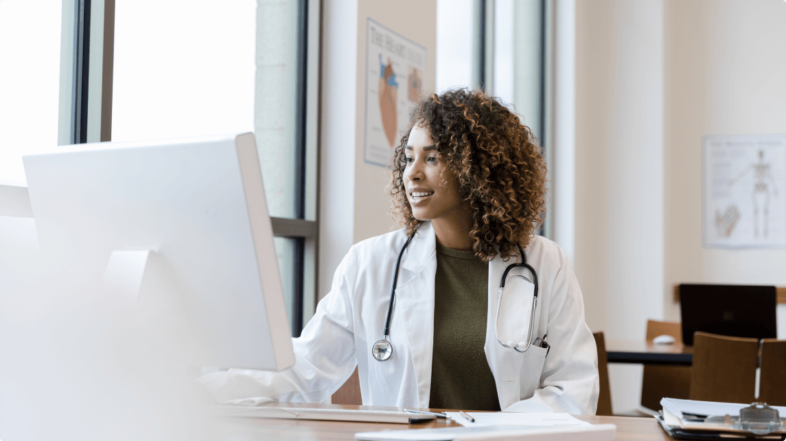Physician looking at a computer - HealthStream