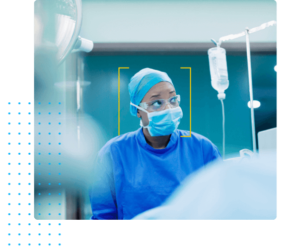 Woman in Surgical Scrubs and IV in the Background - Clinical Development by HealthStream